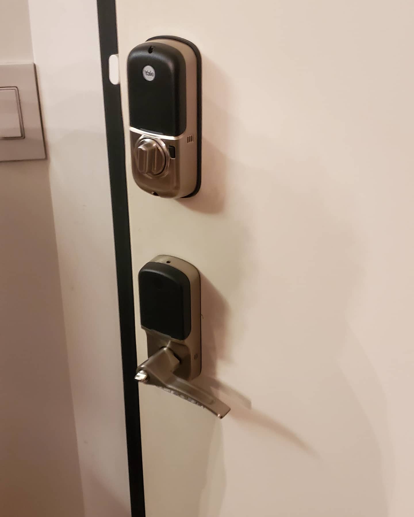 Electronic Yale smart lock installed on a residential door